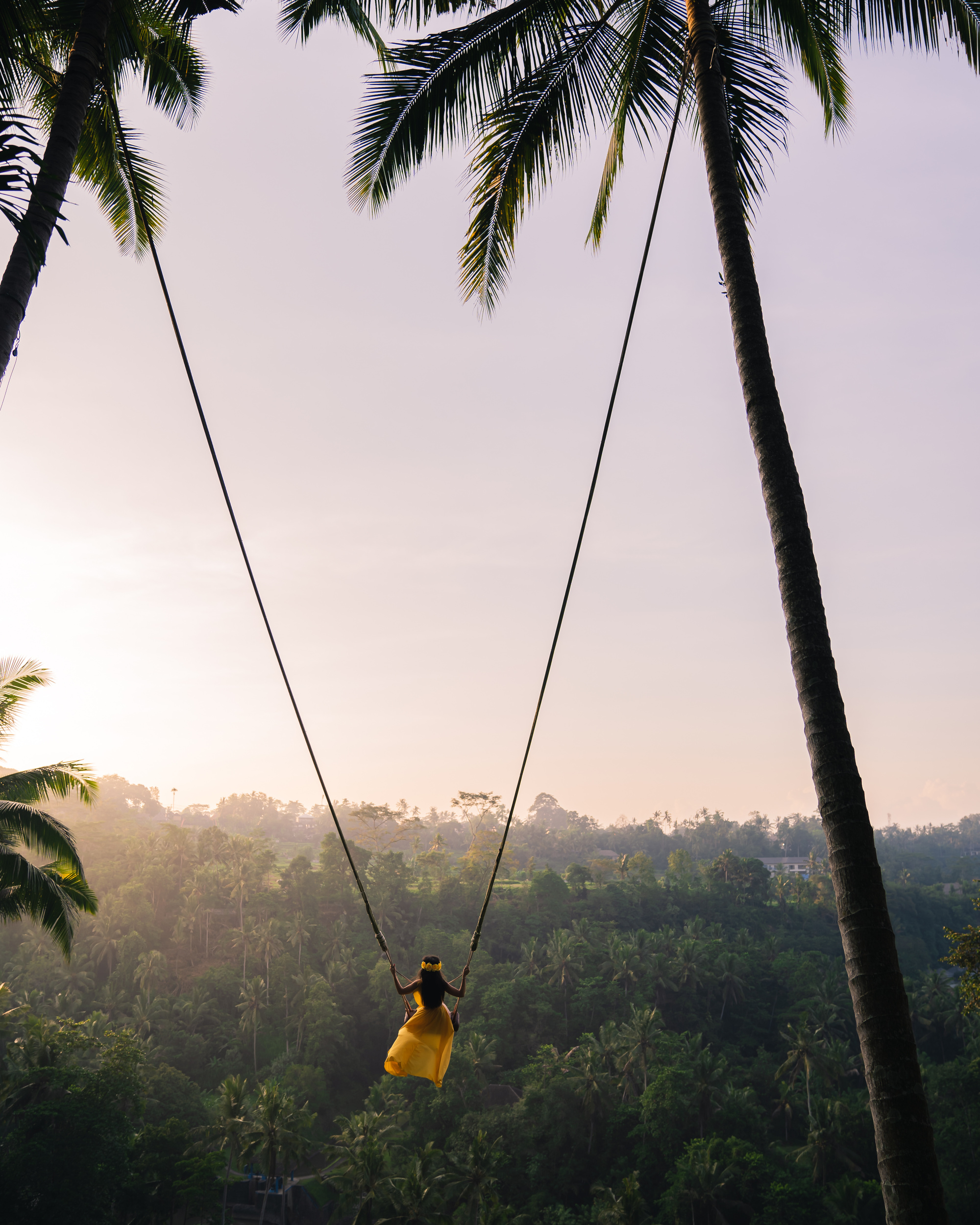 Young woman swinging over the jungle, Bali